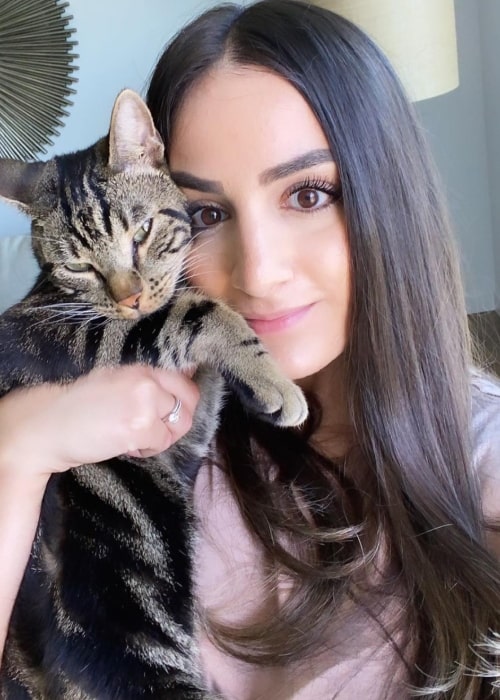 Fifi Furrha as seen in a picture that was taken in July 2021, with her cat Chase